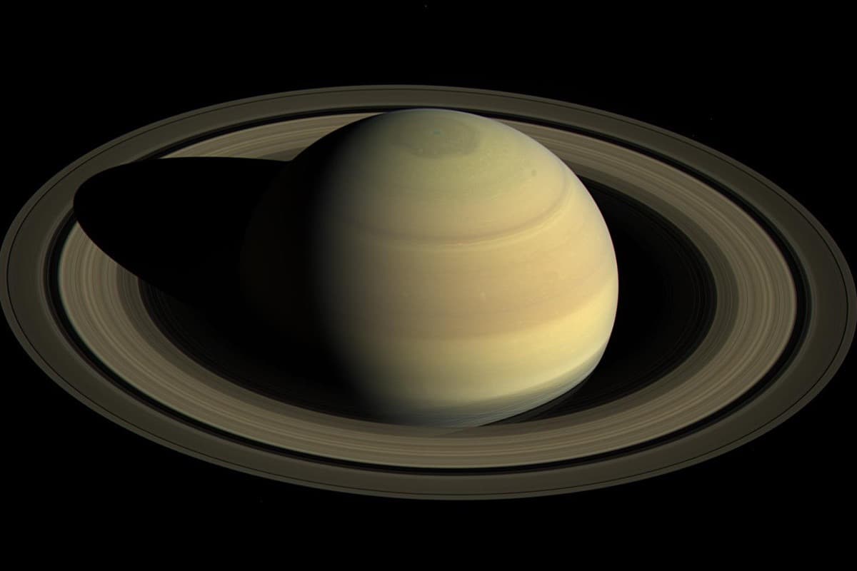 NASA image of Saturn showing its magnificent ring system and golden color, perfect for telescope observation